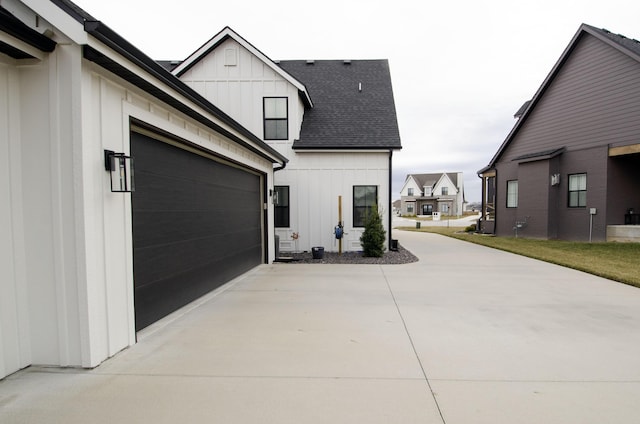 view of side of property featuring a garage