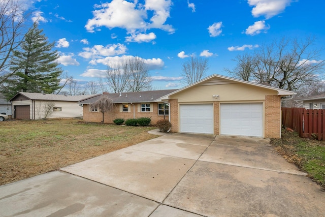 ranch-style house with a garage and a front yard