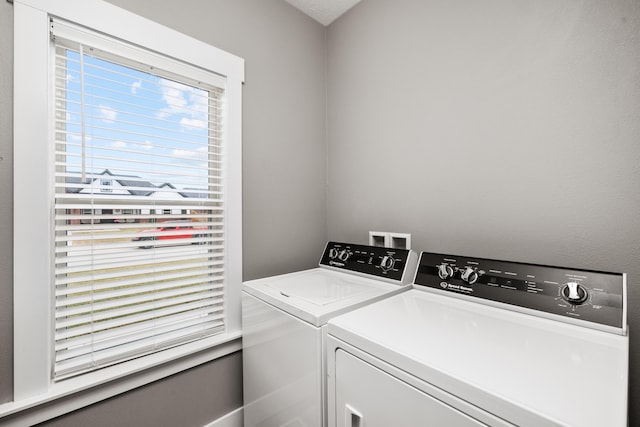 laundry room with independent washer and dryer