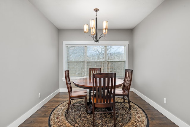 dining room featuring a chandelier and dark hardwood / wood-style flooring