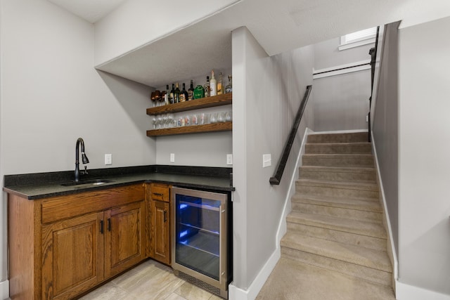 bar featuring sink and beverage cooler