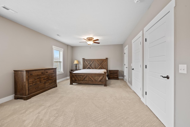 bedroom with ceiling fan and light colored carpet