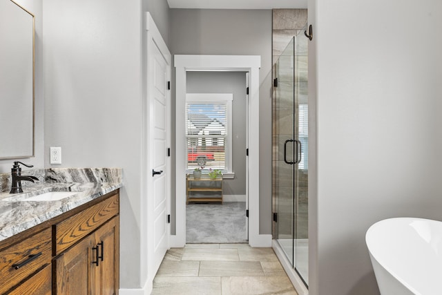 bathroom featuring vanity and separate shower and tub