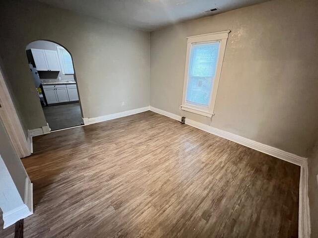 spare room featuring dark hardwood / wood-style floors