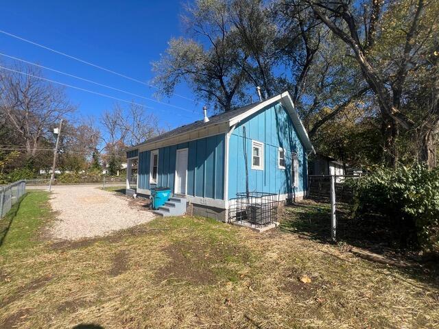 view of property exterior with a yard