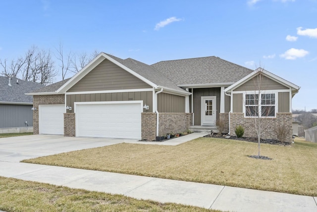 view of front of home featuring a garage and a front lawn