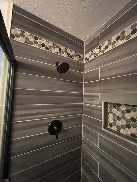 room details with a tile shower