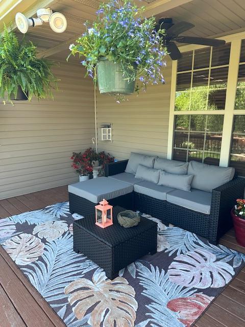 wooden deck featuring an outdoor hangout area