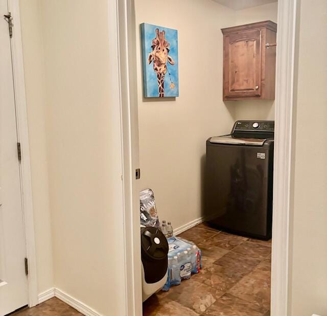 laundry room with washer / clothes dryer and cabinets