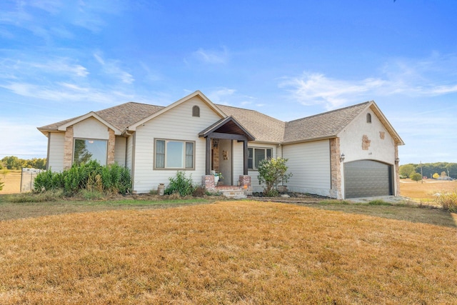 ranch-style house with a garage and a front yard