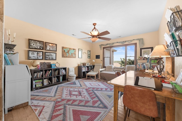 office area featuring wood-type flooring and ceiling fan