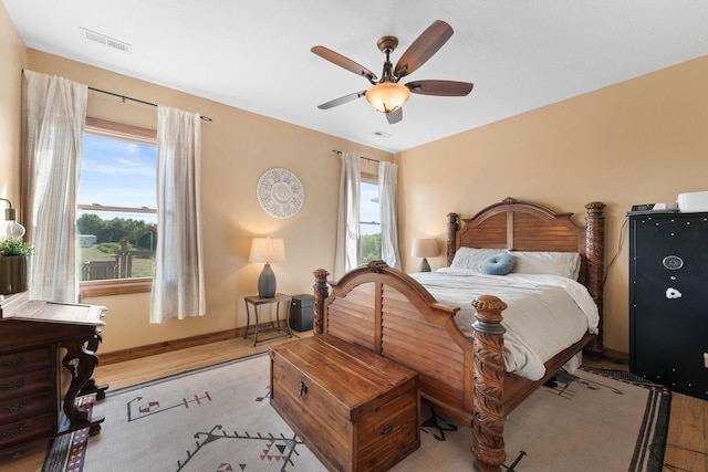 bedroom with ceiling fan and light wood-type flooring