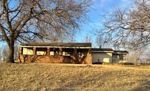 back of house with a yard