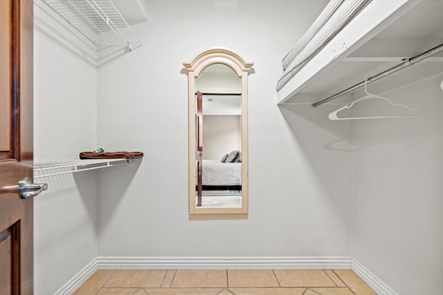 spacious closet featuring tile patterned floors