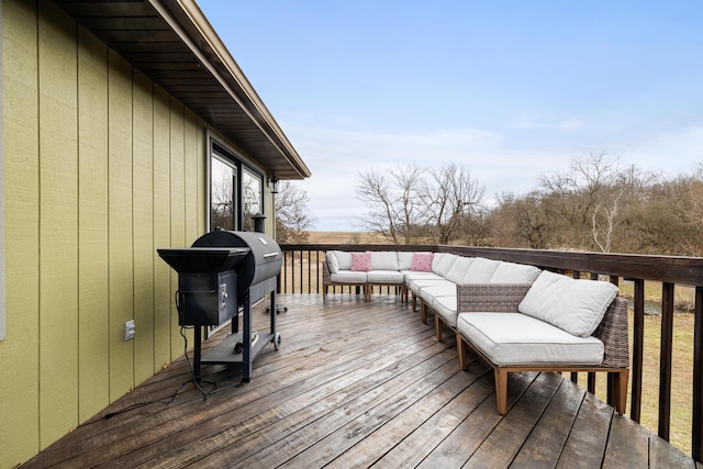 wooden terrace featuring a grill