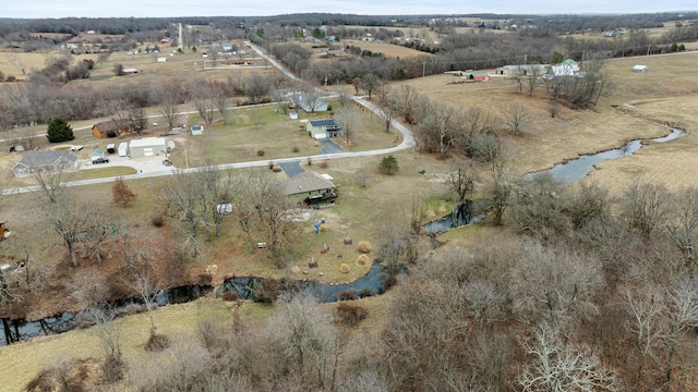 drone / aerial view featuring a water view and a rural view