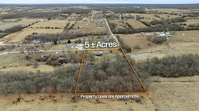 birds eye view of property featuring a rural view