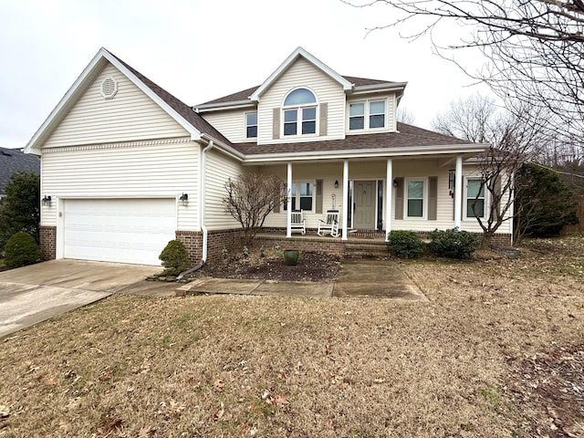 view of front of property with a garage and covered porch