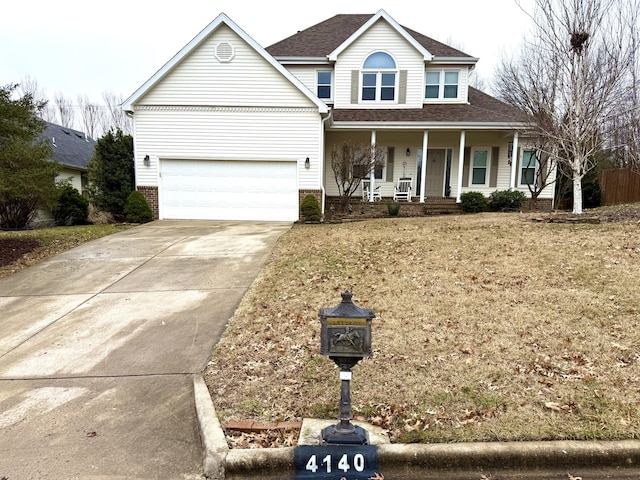 view of front property featuring a garage and covered porch