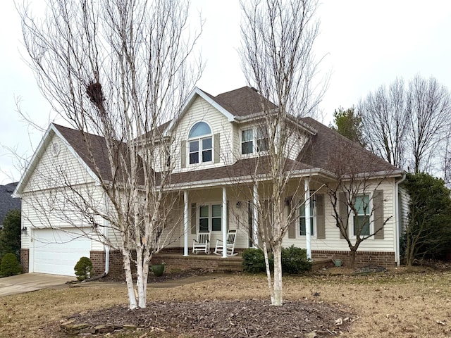 view of front facade with a garage and covered porch