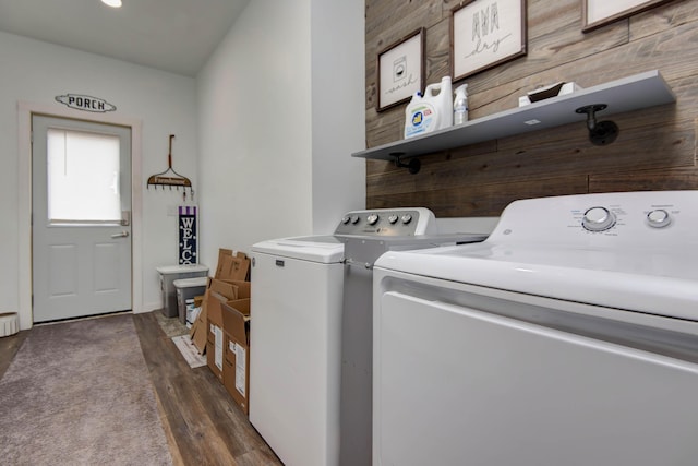 laundry area featuring dark hardwood / wood-style flooring and washing machine and clothes dryer