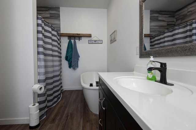 bathroom featuring vanity, toilet, and hardwood / wood-style floors