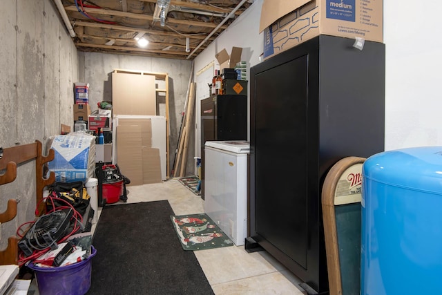 basement featuring fridge