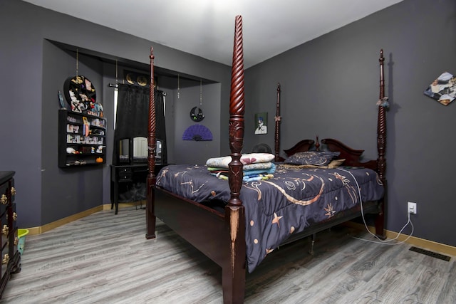 bedroom featuring hardwood / wood-style floors