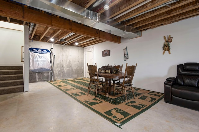 dining area featuring concrete flooring