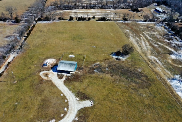 birds eye view of property with a rural view