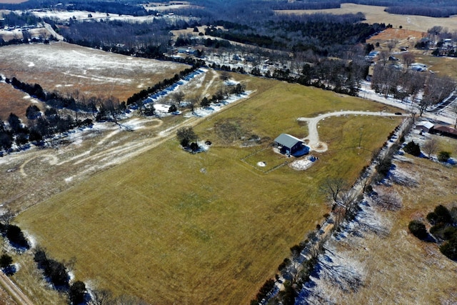 birds eye view of property with a rural view