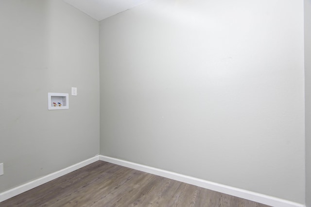 washroom featuring dark wood-type flooring and hookup for a washing machine