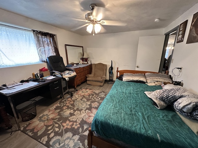 bedroom featuring ceiling fan and light wood-type flooring