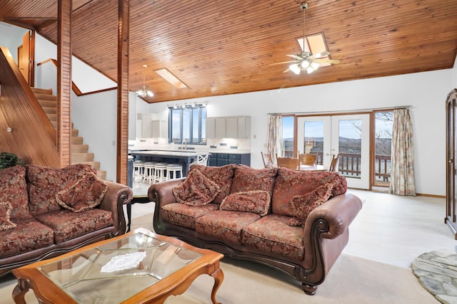 living room with high vaulted ceiling, sink, ceiling fan, wood ceiling, and french doors