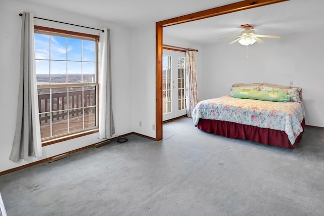 carpeted bedroom featuring french doors and ceiling fan