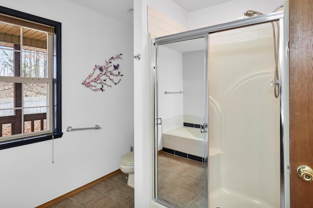 bathroom featuring tile patterned flooring, shower with separate bathtub, and toilet