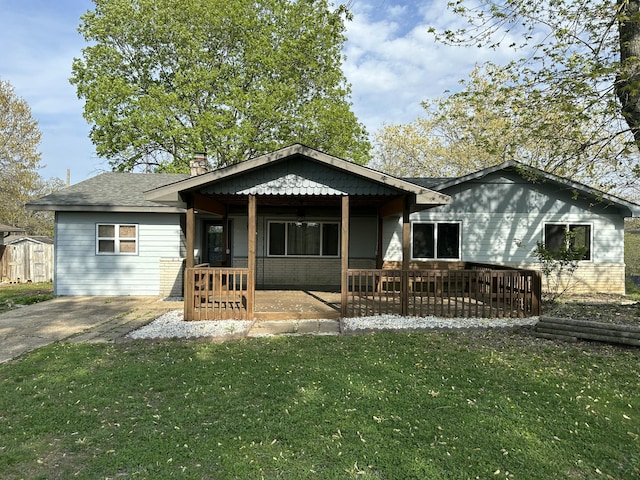 rear view of house with a lawn