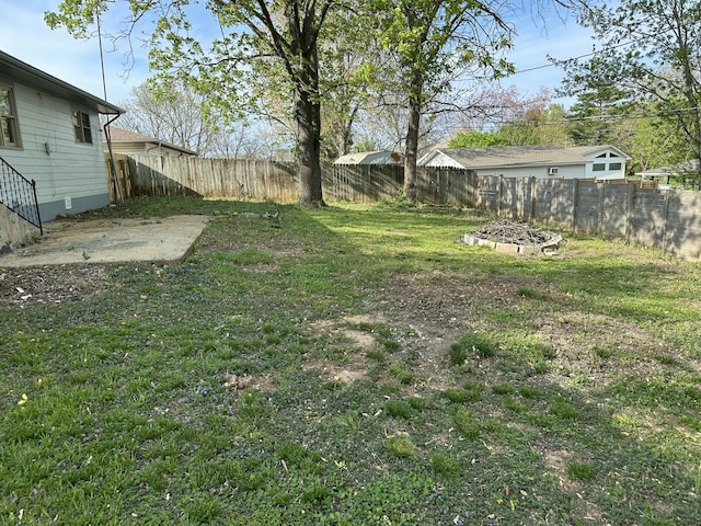 view of yard featuring a patio and a fenced backyard
