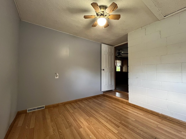 210 Pine St, West Plains, MO 65775 - unfurnished room with light wood-type flooring, a textured ceiling, and ceiling fan