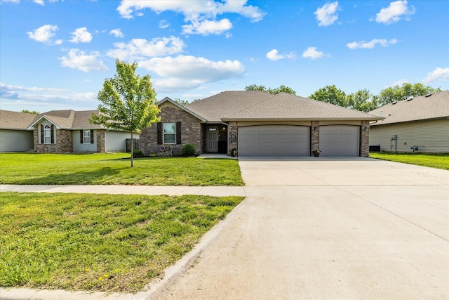 ranch-style home featuring a garage and a front lawn