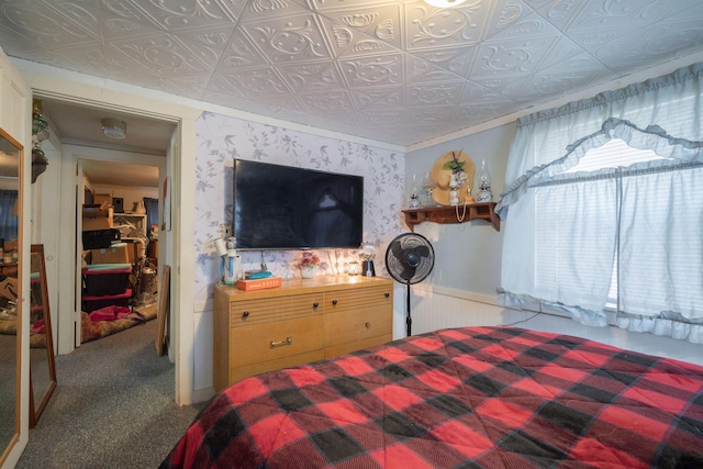 carpeted bedroom with ornamental molding