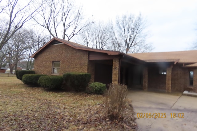 view of front of home featuring brick siding