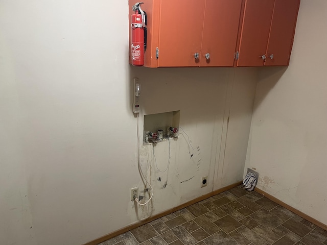 clothes washing area featuring cabinets and hookup for a washing machine