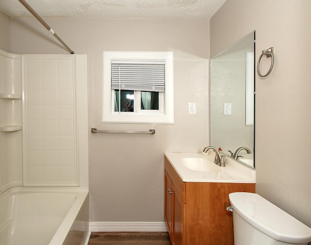 full bathroom with toilet, a textured ceiling, vanity, shower / bath combination, and hardwood / wood-style floors