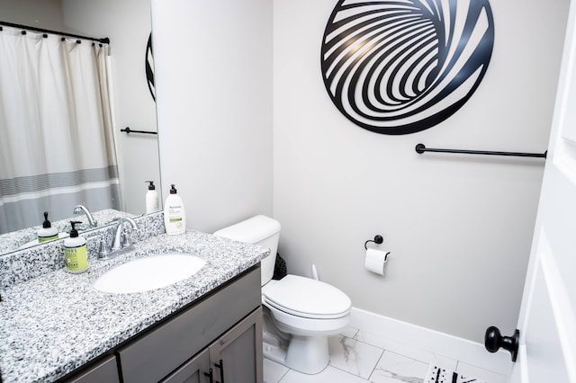 bathroom with vanity and toilet