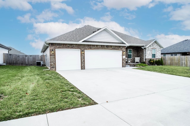 view of front of house featuring a garage and a front yard