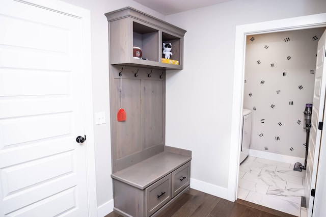 mudroom with independent washer and dryer