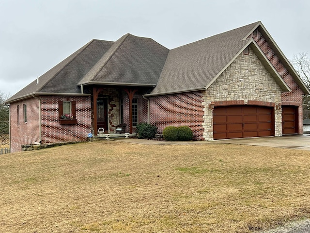 view of front of house with a garage and a front yard