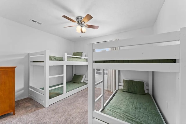 unfurnished bedroom featuring ceiling fan and carpet floors