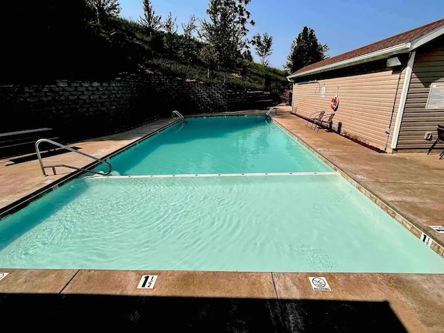 view of pool featuring a patio